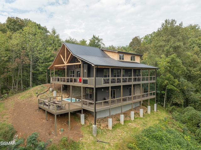 back of property featuring a balcony