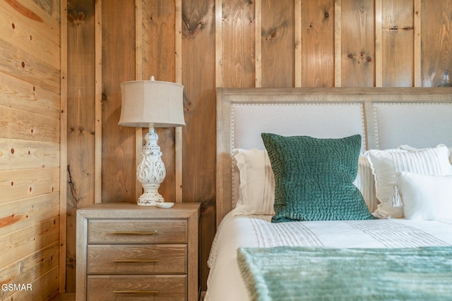 bedroom with wooden walls