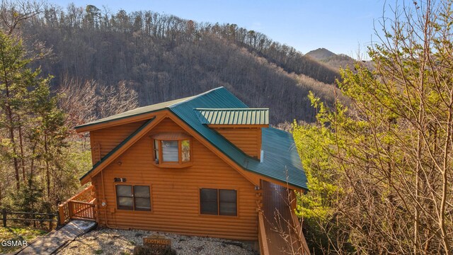 back of house with a mountain view