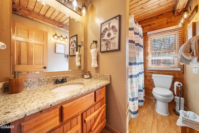 bathroom featuring a shower with curtain, hardwood / wood-style floors, toilet, vanity, and wood ceiling