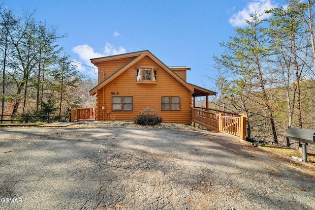 view of side of property with a deck