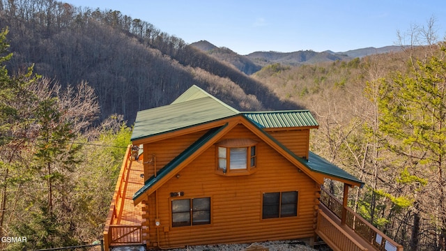 view of home's exterior featuring a mountain view