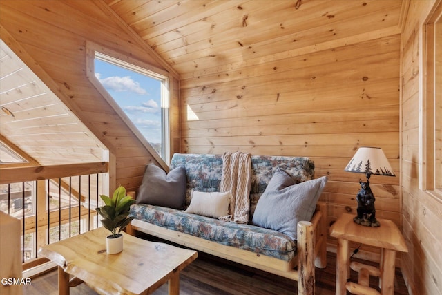 sitting room with wood ceiling, vaulted ceiling, wooden walls, and wood finished floors