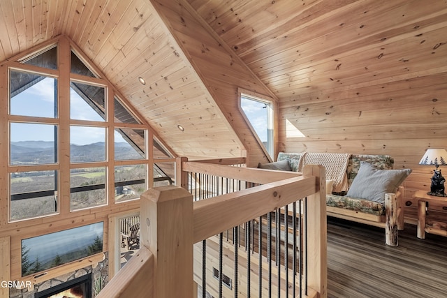 bedroom featuring high vaulted ceiling, wood ceiling, a mountain view, and wood walls