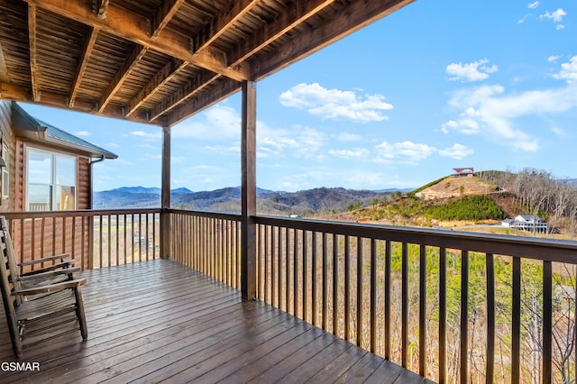 wooden terrace with a mountain view