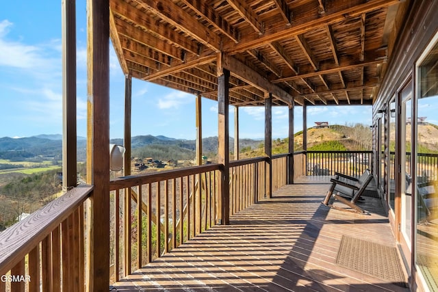 wooden deck featuring a mountain view