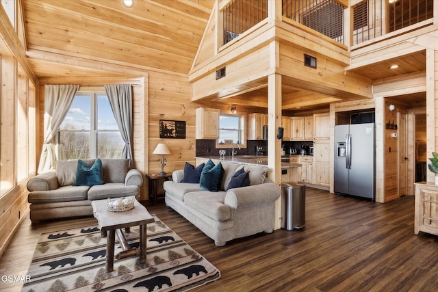 living room featuring wooden ceiling, plenty of natural light, and wooden walls