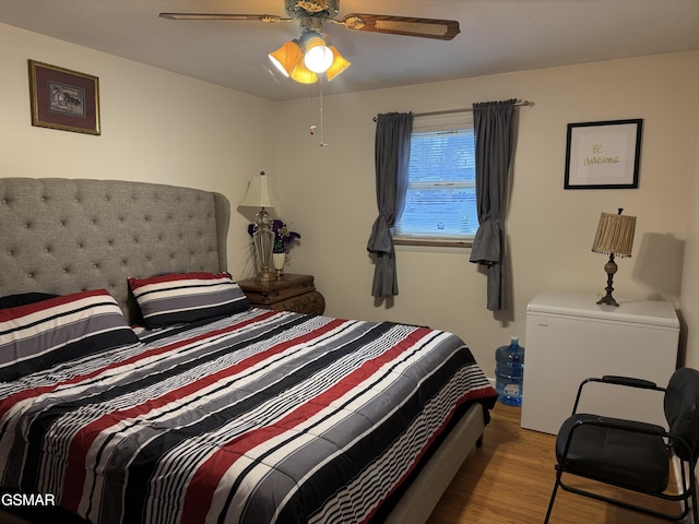 bedroom with ceiling fan and light wood finished floors