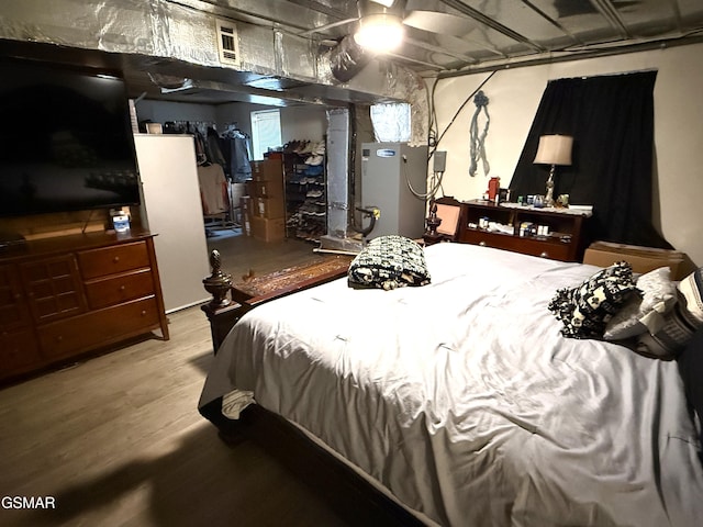 bedroom featuring wood finished floors