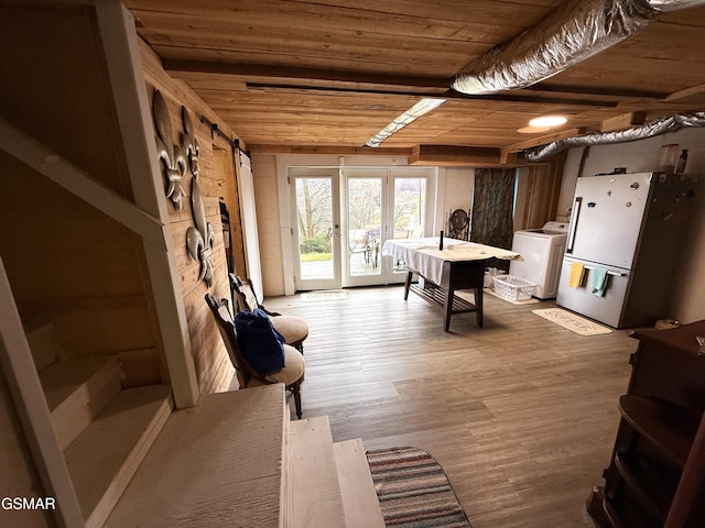 rec room with washer / clothes dryer, wood finished floors, and wood ceiling