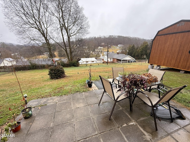 view of patio / terrace featuring fence and outdoor dining space