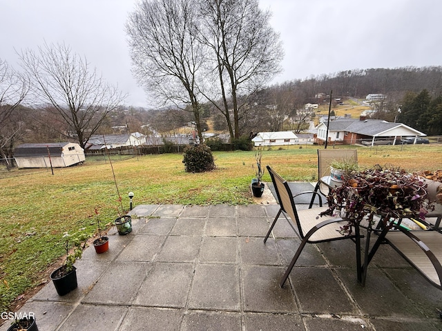 view of patio / terrace featuring fence