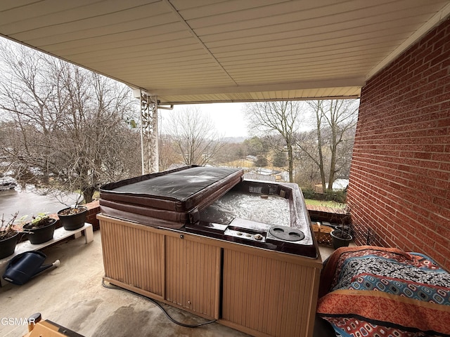 view of patio / terrace with a hot tub