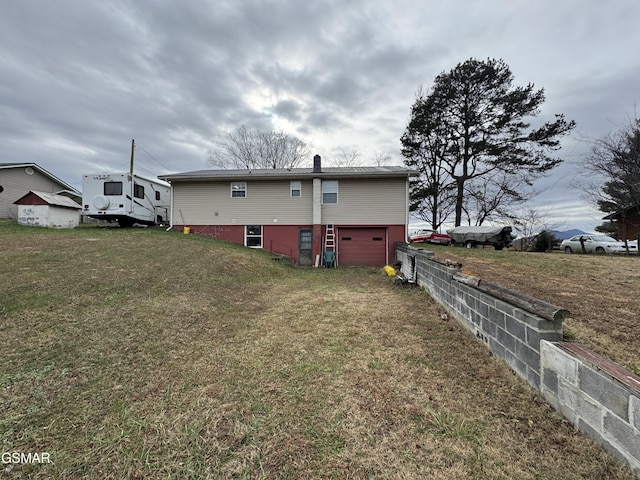 exterior space with a lawn and a garage