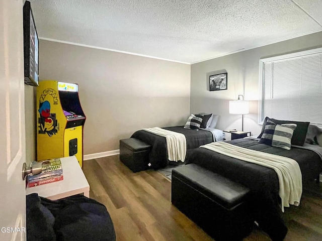 3815 Parkway Pkwy Apt 13, Gatlinburg, TN 37738 - bedroom with wood finished floors, crown molding, a textured ceiling, and baseboards