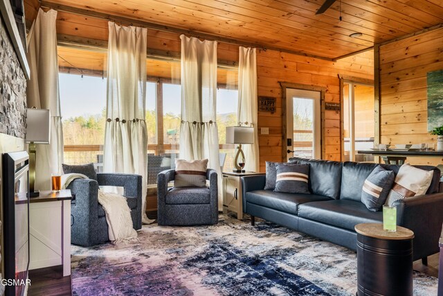 living room with wood walls and wood ceiling