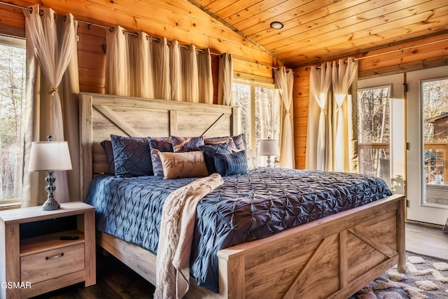 bedroom with dark hardwood / wood-style flooring, wooden ceiling, and lofted ceiling