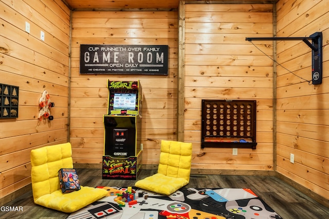 rec room with wood walls