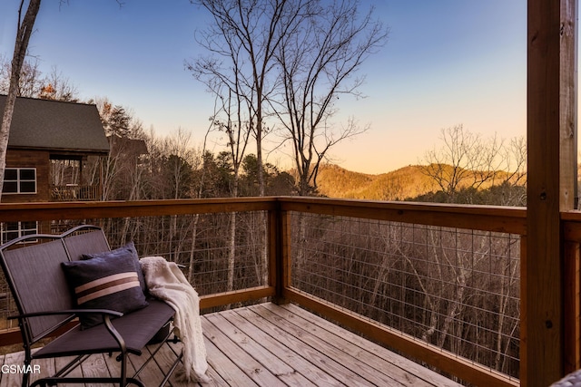 deck at dusk with a mountain view