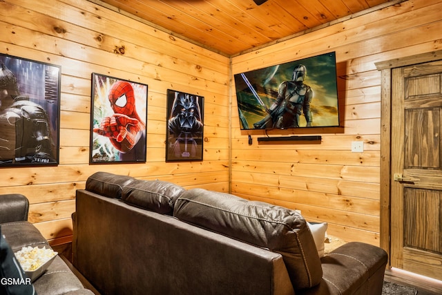 cinema room with wood ceiling and wooden walls