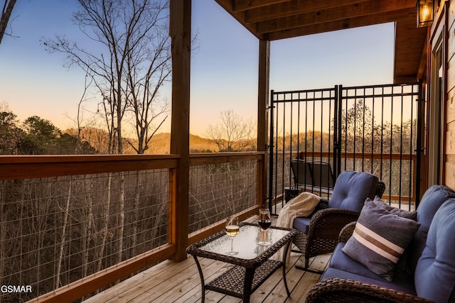 view of balcony at dusk