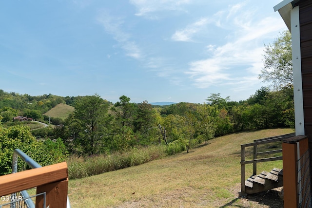 view of yard with a view of trees