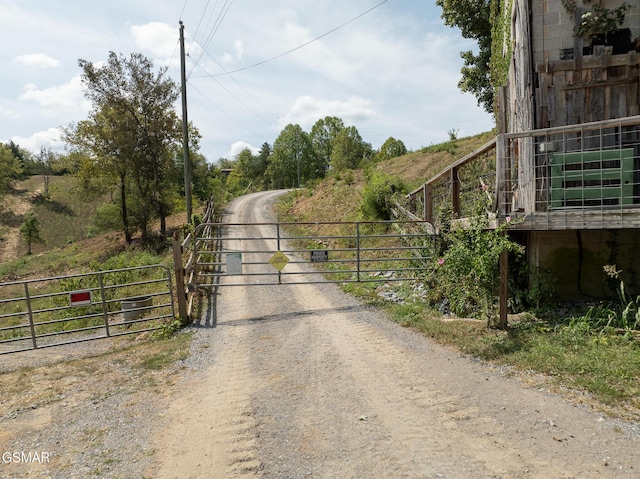 view of street featuring a gate and a gated entry