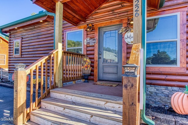 property entrance with covered porch