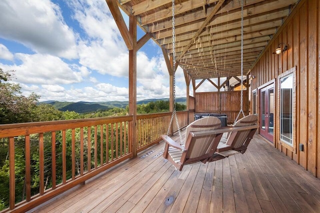 wooden deck with a mountain view