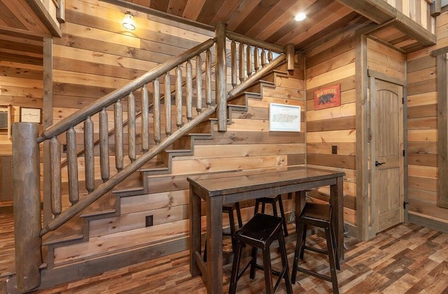 interior space featuring hardwood / wood-style floors, wood walls, and wood ceiling