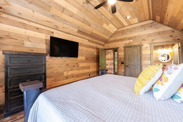 bedroom with vaulted ceiling, ceiling fan, wood walls, and wood ceiling