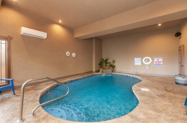 view of pool featuring a wall mounted air conditioner, pool water feature, and a patio