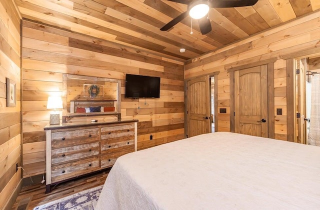 bedroom featuring wooden walls, ceiling fan, and wood ceiling