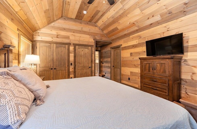 bedroom with vaulted ceiling, ceiling fan, wooden walls, and wood ceiling