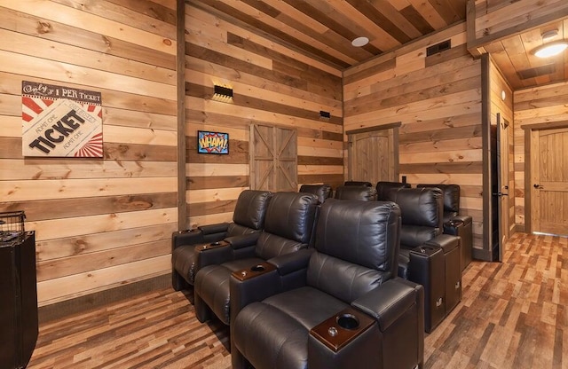 cinema room with wooden walls, hardwood / wood-style floors, and wooden ceiling