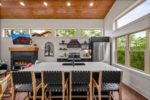 2385 Forge Hideaway Loop Unit 2, Pigeon Forge, TN 37863 - dining space with wooden ceiling, dark wood-style floors, recessed lighting, a tiled fireplace, and baseboards