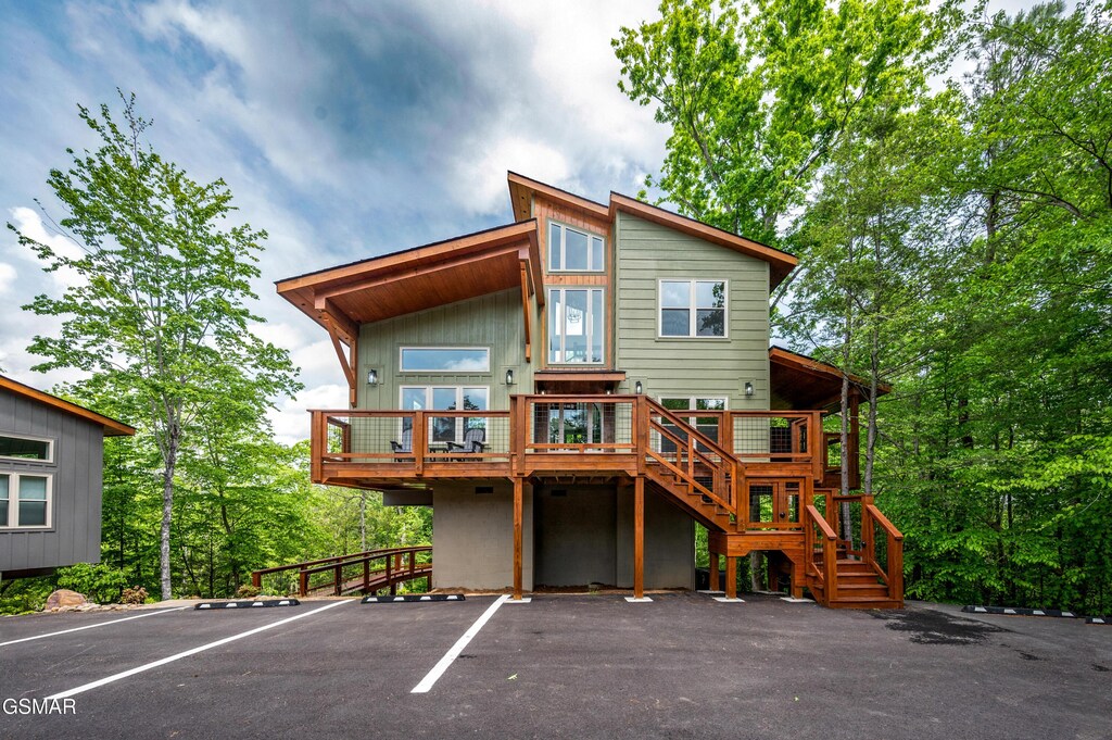 2385 Forge Hideaway Loop Unit 2, Pigeon Forge, TN 37863 - rear view of property with stairs, uncovered parking, and a deck