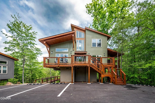 2385 Forge Hideaway Loop Unit 2, Pigeon Forge, TN 37863 - rear view of property with stairs, uncovered parking, and a deck