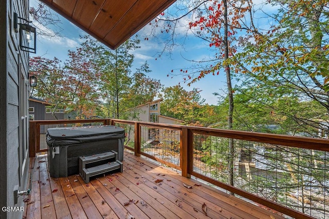 deck featuring a hot tub