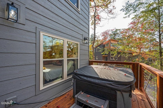 wooden terrace featuring a grill