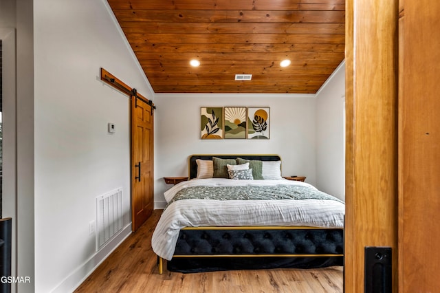 2385 Forge Hideaway Loop Unit 2, Pigeon Forge, TN 37863 - bedroom featuring wooden ceiling, a barn door, recessed lighting, vaulted ceiling, and wood finished floors