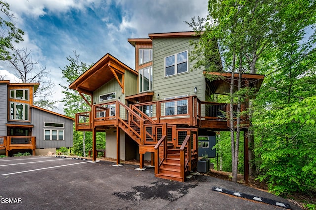 2385 Forge Hideaway Loop Unit 2, Pigeon Forge, TN 37863 - back of property with stairs, a deck, uncovered parking, and central AC
