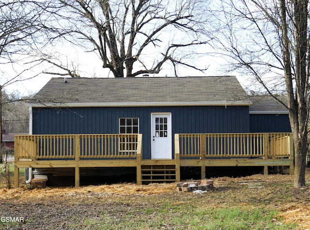 back of house with a wooden deck