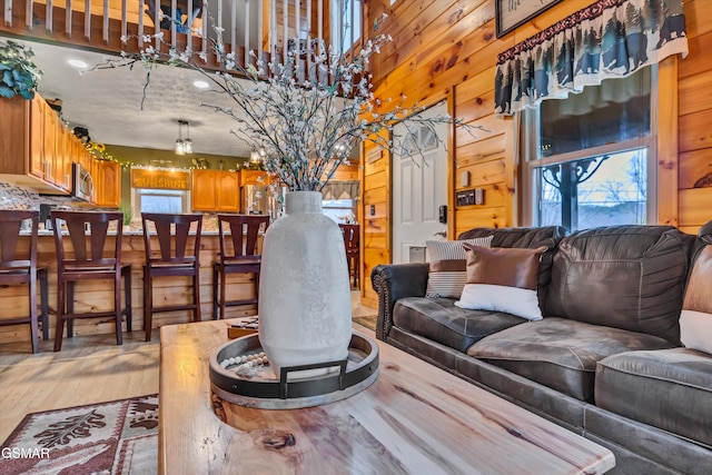 3501 Ginseng Way, Sevierville, TN 37862 - living area featuring light wood finished floors, wood walls, and a towering ceiling