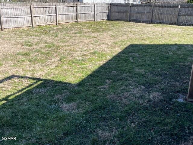 view of yard featuring a fenced backyard