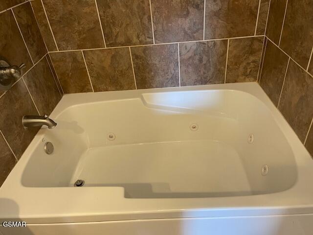 bathroom with a jetted tub