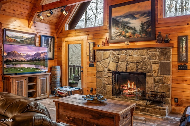 living area featuring wooden walls, wooden ceiling, and hardwood / wood-style floors