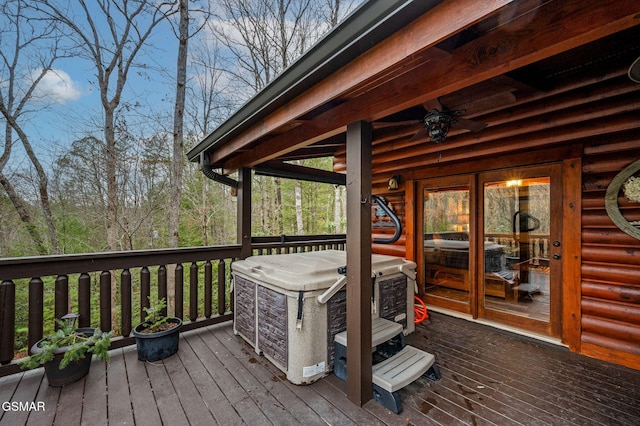 wooden terrace with a ceiling fan