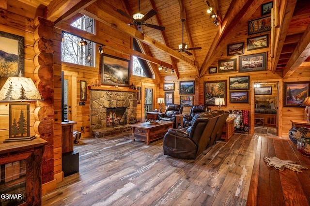 living area featuring wooden walls, a fireplace, wood ceiling, wood-type flooring, and beamed ceiling