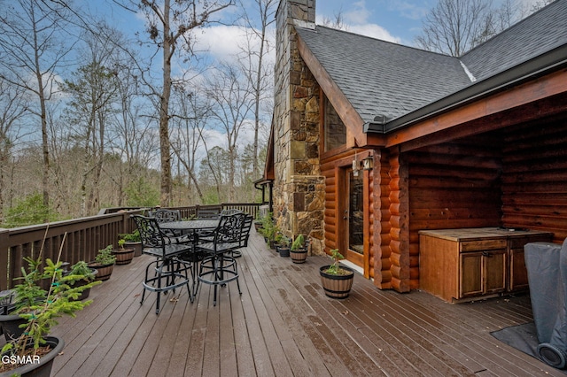 wooden terrace with outdoor dining area